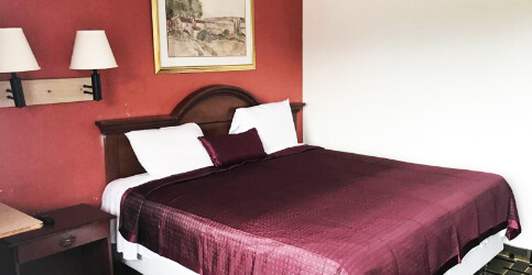 bed with maroon color theme