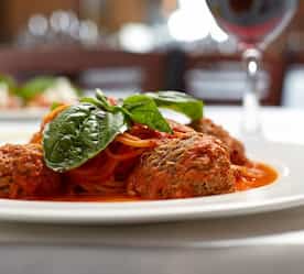 Italian dish with meatballs and garnish