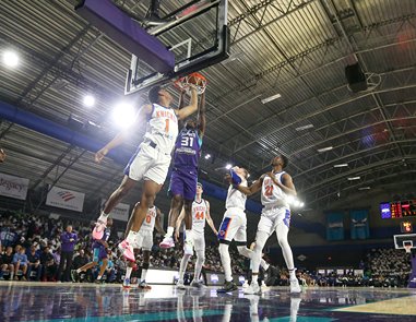 Two basketball teams playing against eachother