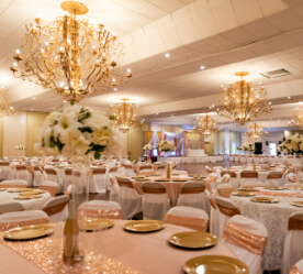 decorated room with tables and chandeliers