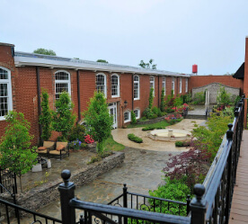 outdoor space between brick buildings