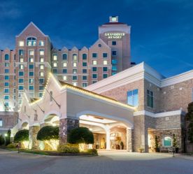 luxury hotel exterior/entrance lit up at night