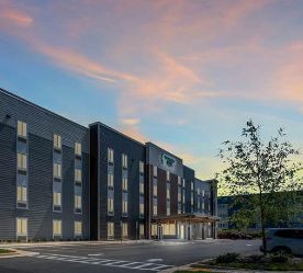 extended stay hotel exterior at dusk