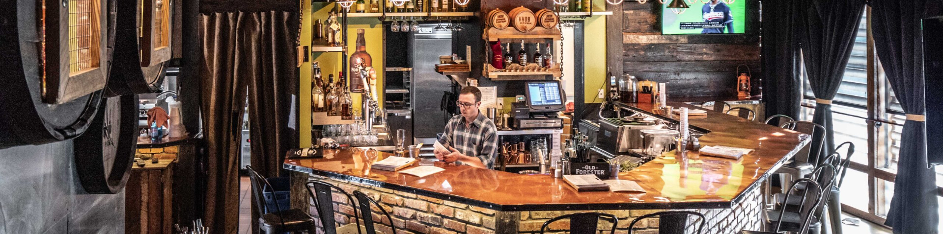 bar area with whiskeys on display