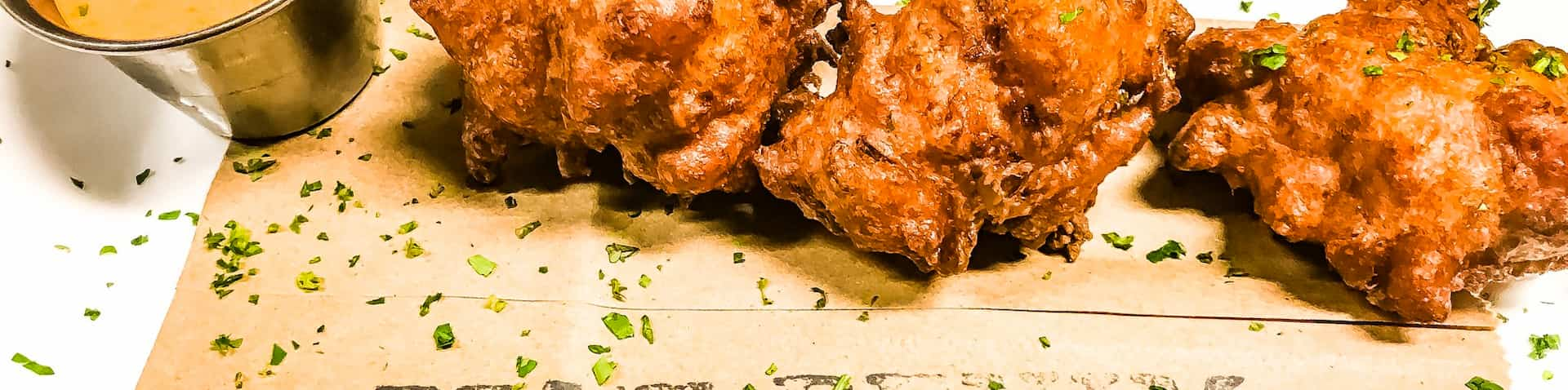 chicken paired with dipping sauce on a cutting board 