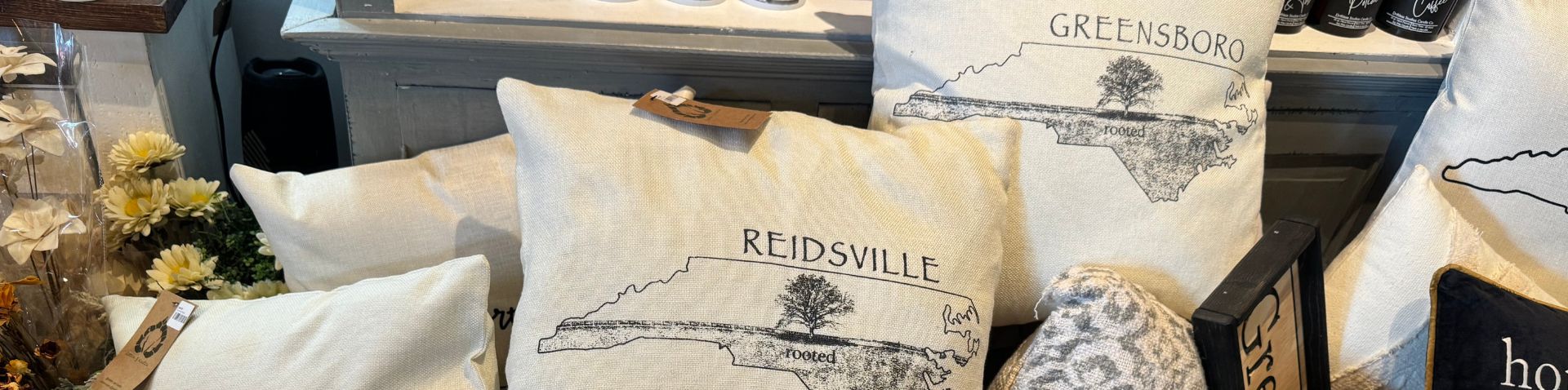 custom pillows with Greensboro and other cities' names on them