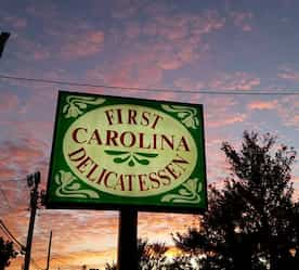 restaurant sign lit up at night