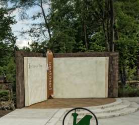 a big book with Gateway Gardens Written on its binding - stage