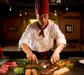 a chef cutting meat