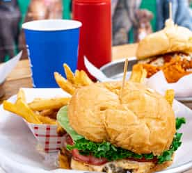 burger meals set out on the patio table