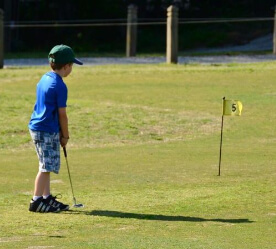 boy golfing