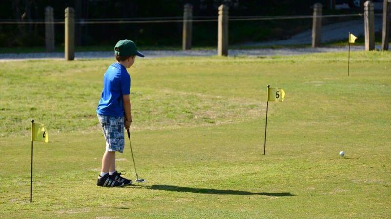 boy golfing