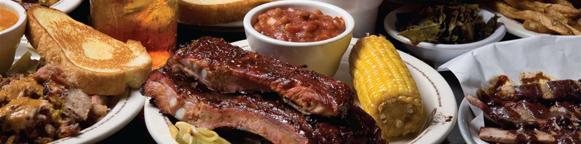 feast with ribs, toast, corn on the cob, beans and more
