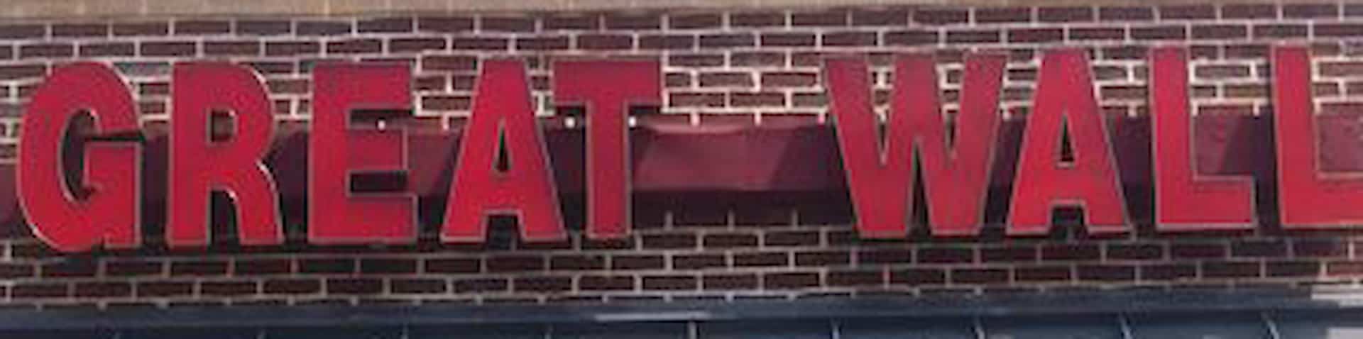 close-up of sign on exterior of restaurant