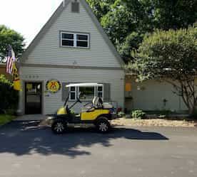 golf cart in front of front office