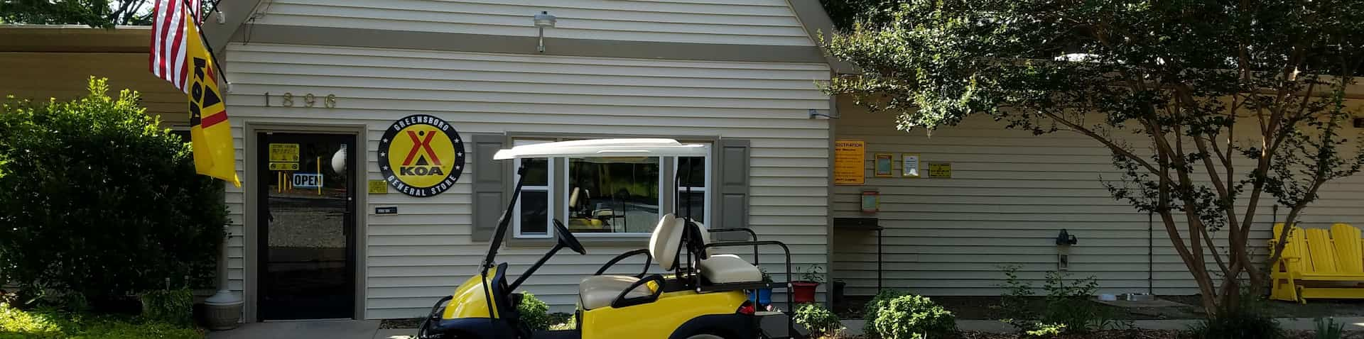 golf cart in front of front office