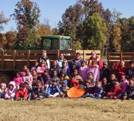Kids in front of tractor