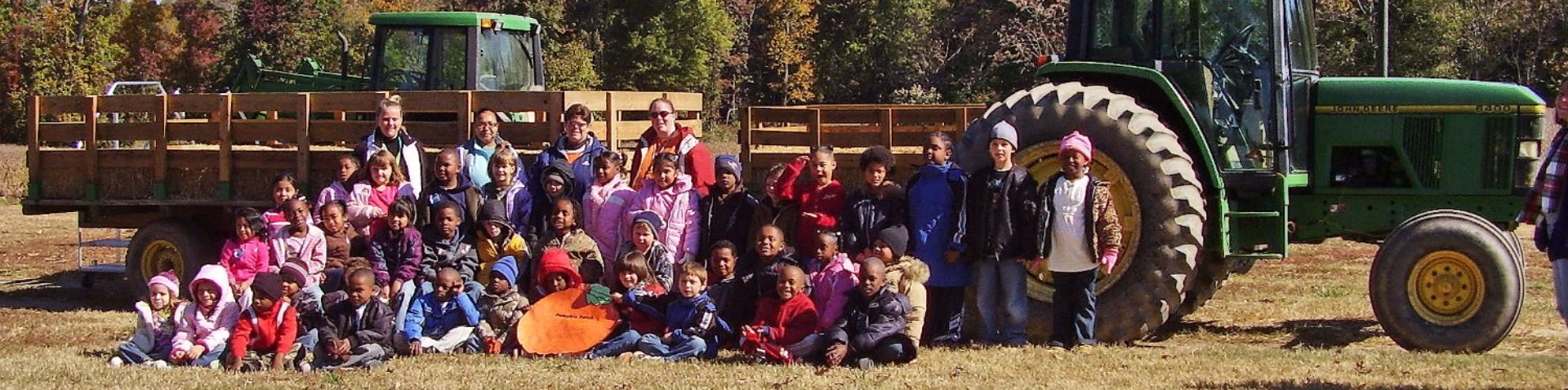 Kids in front of tractor