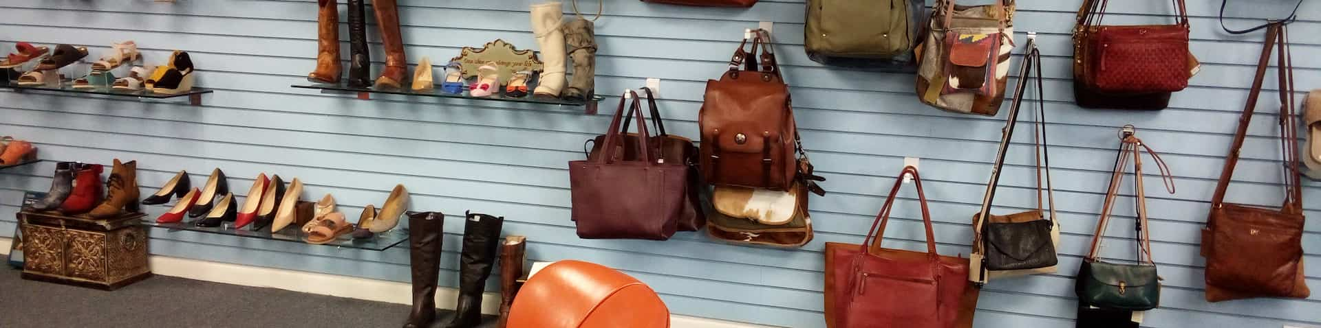 a wall of purses and shoes