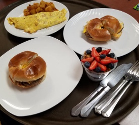 Breakfast sandwiches and fruit