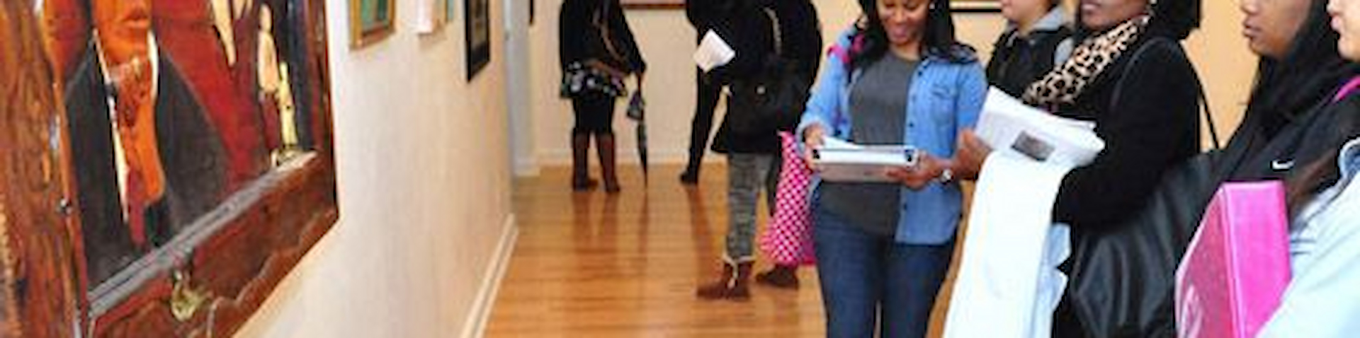 students looking at painting in the gallery