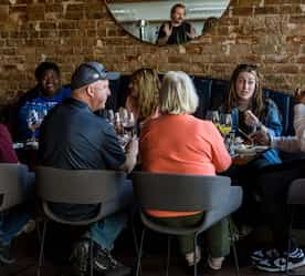 tour gathered around a table eating and talking