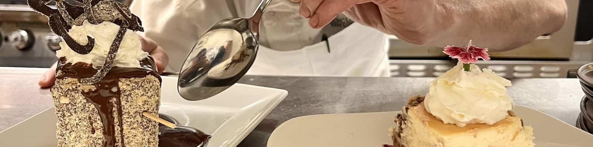 chef puttiing final touches on dessert