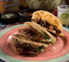 3 soft pita tacos on a plate
