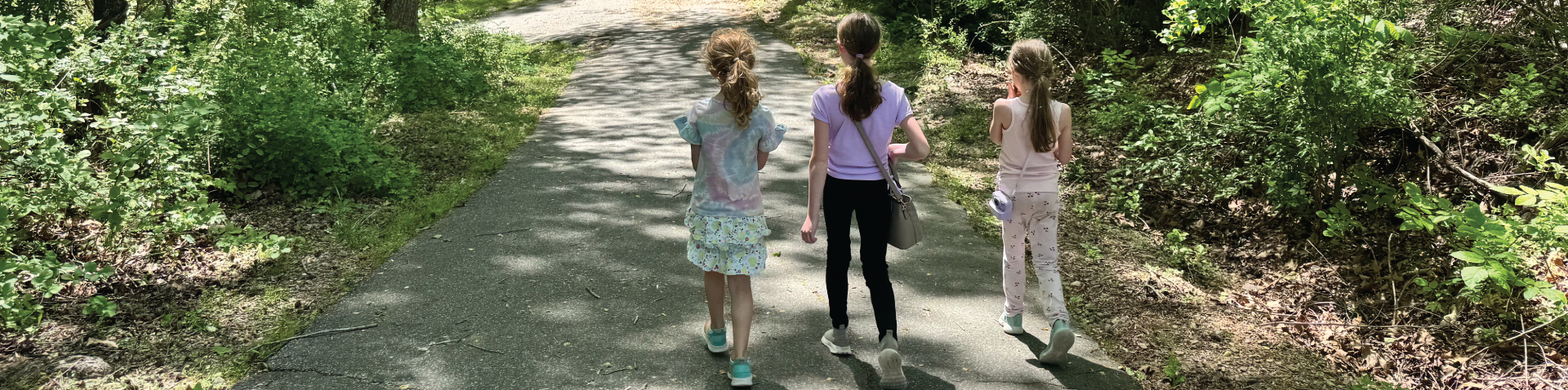 girls walking in the wood